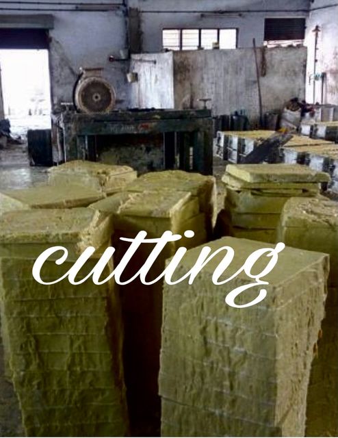Cutting: Cured blocks are cut into cakes before stamping.