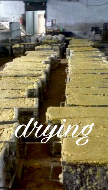 Drying: Blocks of soap cure for weeks before they are cut. This is what makes the cake firm.